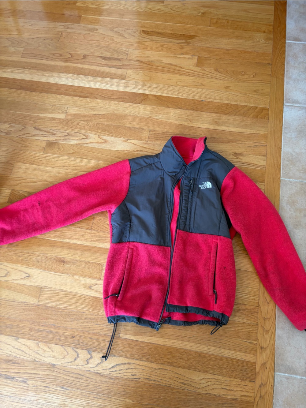 The North Face women’s pink and Black Fleece Jacket